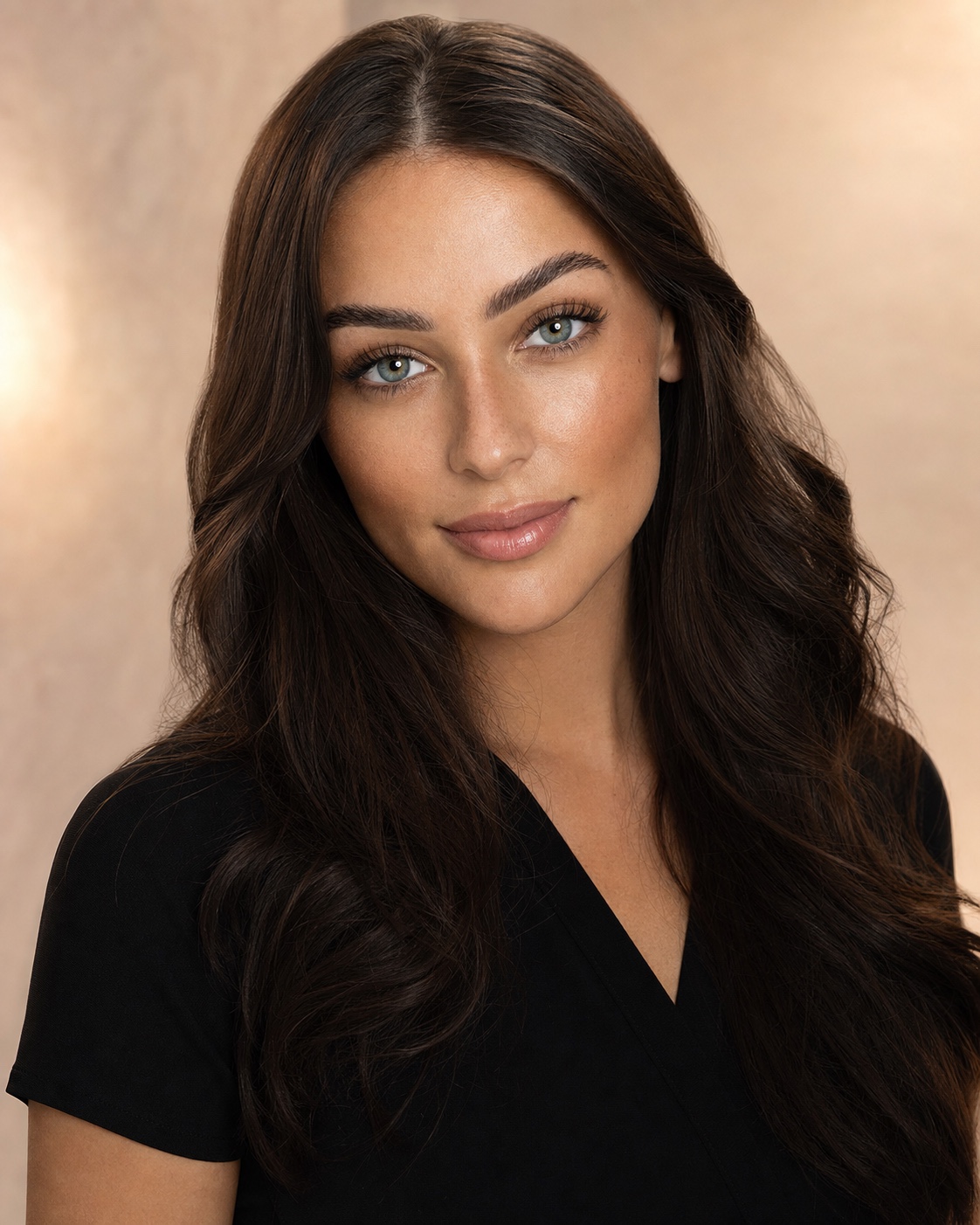 Polished brunette beauty portrait highlighting defined lashes and brows