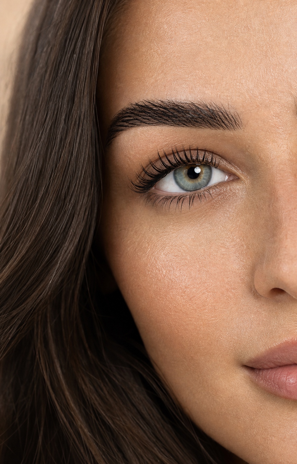 Natural lifted lashes in a polished close-up beauty portrait